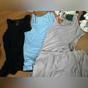 Kyte baby mama tanks and one pair of shorts. Purple, blue, black